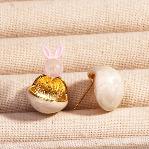 Golden rabbit earrings with pink bunny head and white shell texture in a dual view