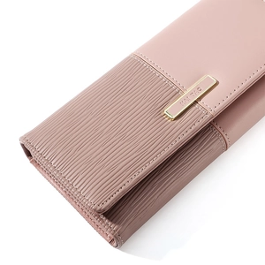 Detail of pink long wallet featuring premium wave textured stitching and gold metal logo
