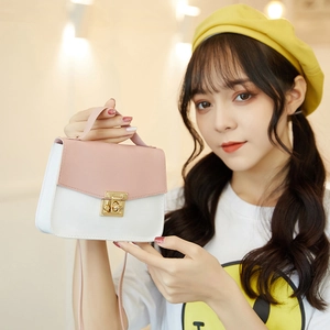 Pink and white contrast square crossbody bag with gold lock and top handle for women