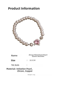 Detail showing pink zircon heart pendant on stretch pearl bracelet, 18.5CM length