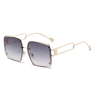 Square punk sunglasses with gold geometric frames and purple gradient lenses