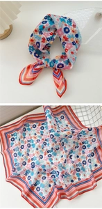Detail of floral cotton linen square scarf with striped edges and breathable texture