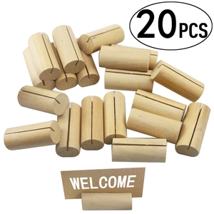 Detailed view of twenty cylindrical wooden card holders with a Welcome sign