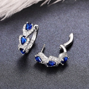Elegant silver hoop earrings featuring pear-cut blue zircon stones and halo micro-diamonds