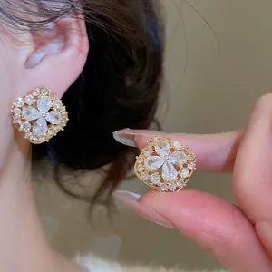Gold plated floral stud earrings with sparkling zircon crystals for women
