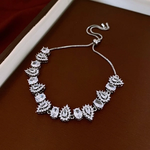 Detail of silver vintage floral bracelet with teardrop diamonds and adjustable drawstring clasp