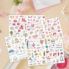 Flatlay of romantic wedding sticker set with heart and cake patterns for guest book