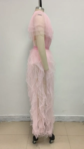 Detailed side view of pink layered mesh ruffles on an elegant V-neck maxi dress