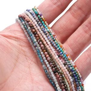 Handheld view of multi-color 2mm faceted natural stone beads for DIY jewelry making