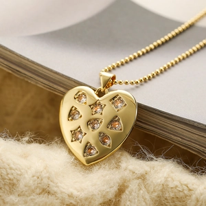 Gold heart pendant necklace with colorful zircon stones on a beaded chain design
