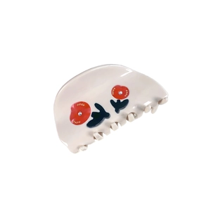 Elegant cream rose hair claw clip with floral patterns and sparkling rhinestones
