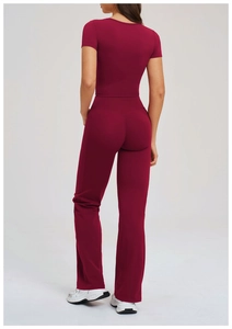 Back view of burgundy yoga set with slim fit short sleeve top and flare pants