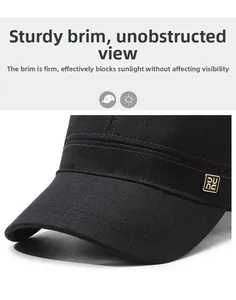Detail of black cotton flat top hat featuring a curved brim and golden metal logo plate