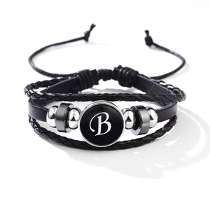 Black multi-layer leather braid bracelet featuring a metal charm with letter B