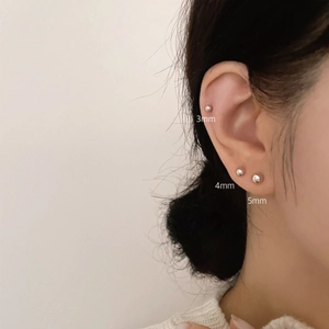 Three sizes of 925 sterling silver ball stud earrings shown on ear from 3mm to 5mm