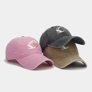Three vintage washed cotton baseball caps with football and heart embroidery in assorted colors