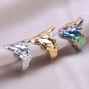 Irregular fluid stainless steel rings set in silver gold and rainbow iridescent finishes