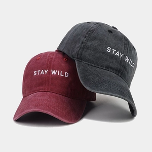 Close-up of Stay Wild letter embroidery on washed cotton vintage baseball caps