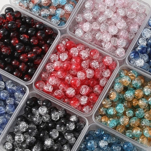 Detailed view of colorful 10mm cracked glass beads stored in clear plastic containers