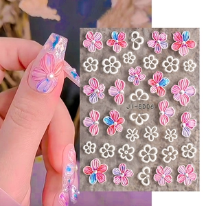 5D embossed nail stickers featuring camellia flowers and pearls on hands and product view
