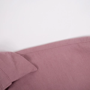 Detail macro shot of vertical ribbed corduroy texture on this mauve midi dress fabric