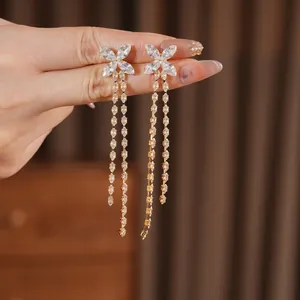 18K gold plated butterfly tassel earrings with sparkling white zircons in a luxury style