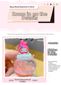 Detail shot of a My Melody acrylic oil keychain featuring colorful beads inside a ball