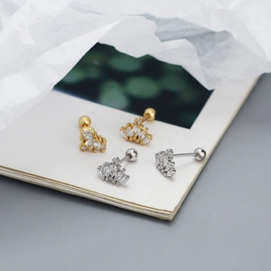 Close-up of 925 sterling silver crown earrings with cubic zirconia and screw backs