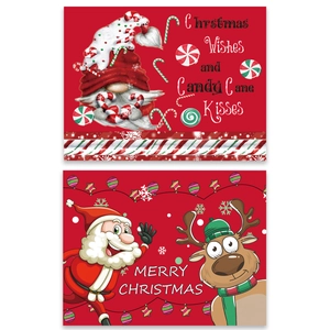 Christmas place mats featuring Santa Claus and Reindeer with festive cartoon prints