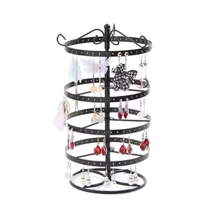 Detailed view of the 4-tier rotating black metal earring display stand with jewelry