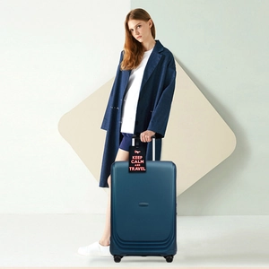 Fashion PVC luggage tag with Keep Calm text on a blue suitcase held by a model