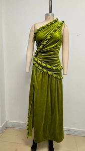 Detail of moss green velvet dress showing intricate thick rope weave decoration on shoulder