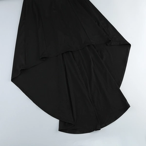 Detail of elegant black dress showing the asymmetrical hemline and premium woven fabric