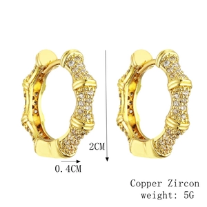 Gold bamboo style hoop earrings with micro-inlaid zircons and polished finish