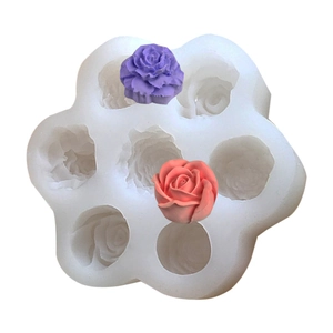 Detailed view of 6-cavity silicone mold with realistic peony flower candle samples