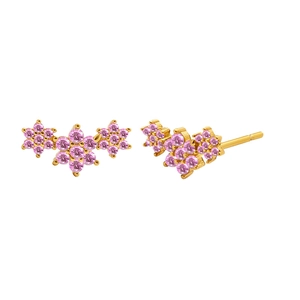 Detailed view of gold wing earrings featuring pink zircon stones on white background