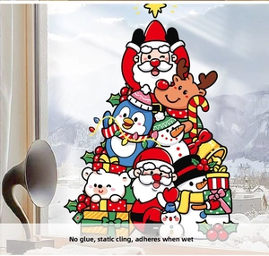 Detail of static Christmas window stickers featuring Santa, elk, and snowman on glass