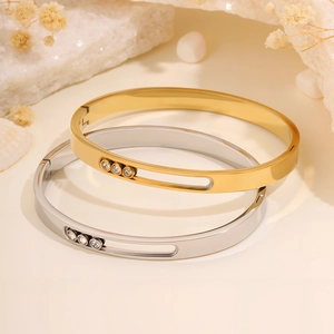 Titanium steel bangles with sliding zircons in gold and silver, elegant open cuff style
