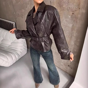Women's vintage biker faux leather jacket with waist belt and wide lapel collar