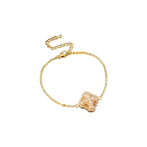 Bracelet plaqué or avec trèfle en perle et détails en petits diamants brillants