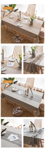 Close-up of minimalist striped linen tablecloth with decorative tassel fringe edges