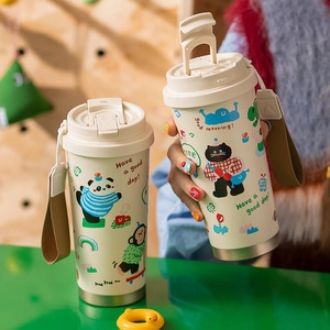 Detail view of cream-colored tin cans with cute animal prints and portable handles
