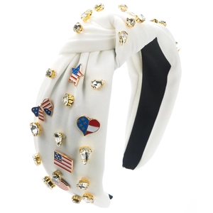 Detail of white knotted headband with American flag charms and sparkling rhinestones