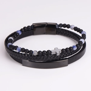 Detail of multi-layer men's bracelet set with cross pendant and blue marble beads