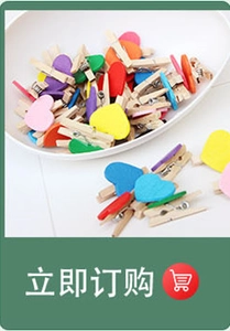 Close-up of assorted colorful wooden heart clips for photo hanging and DIY crafts