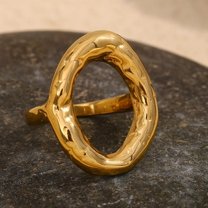 Macro shot of 18K gold plated irregular oval ring with molten lava texture finish