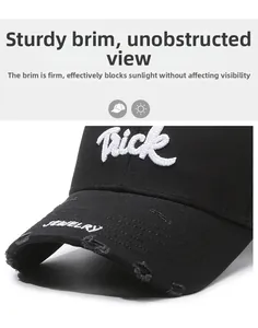 Detailed view of Trick embroidery and distressed brim on a black cotton baseball cap