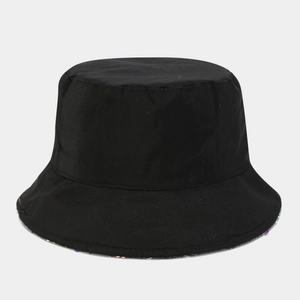 Detail shot of black bucket hat featuring vibrant rainbow sequins and polyester texture