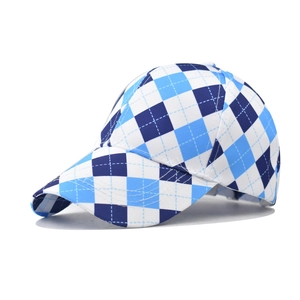 Detail view of cotton baseball cap with blue and white argyle diamond pattern and curved brim