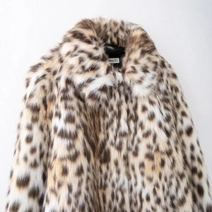 Chic leopard print faux fur jacket for women with high collar and warm texture details
